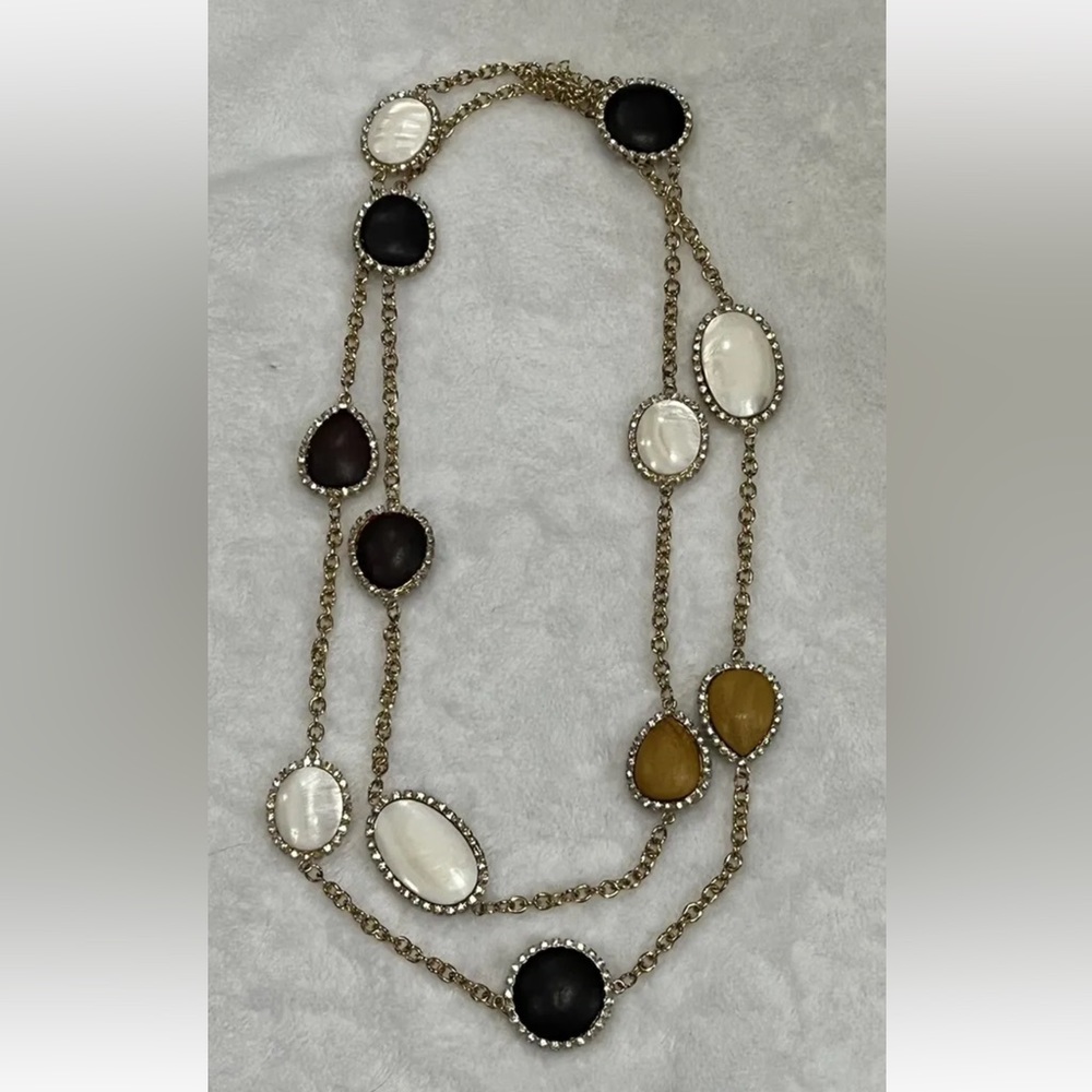 Gold tone necklace with wood and mother of Pearl shapes 52” long V by Eva